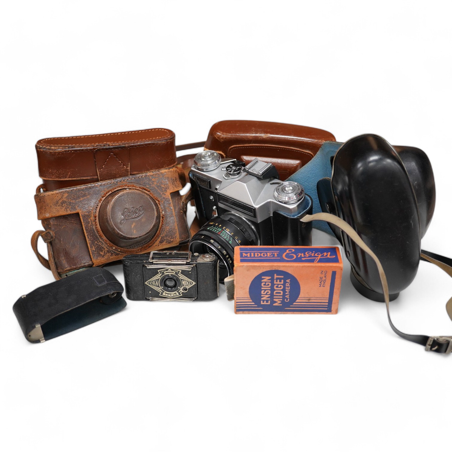 A Leica Model II camera in its original leather case, No. 204618, together with four additional cameras; a Zeiss Ikonta, a Zeiss Nettar, a Prinzflex 500E, and an Ensign Midget camera in its original card box with instruc